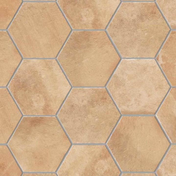 A flat lay of pale terracotta Seville Hexagon tiles laid in a classic grid pattern and finished with Medium Grey grout