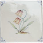 Cut out of an ivory square tile with hand painted yellow flower