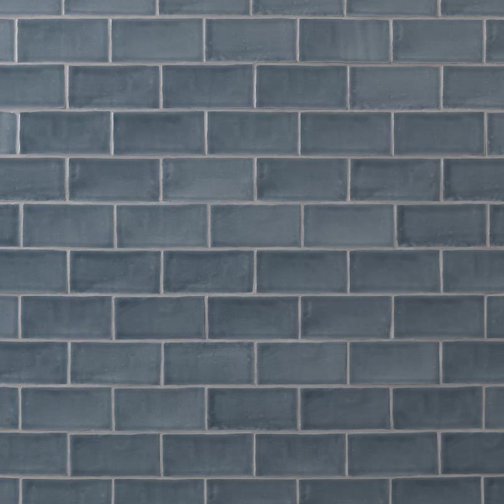 Wall of metro dark grey blue handmade wall tiles finished with Medium Grey grout