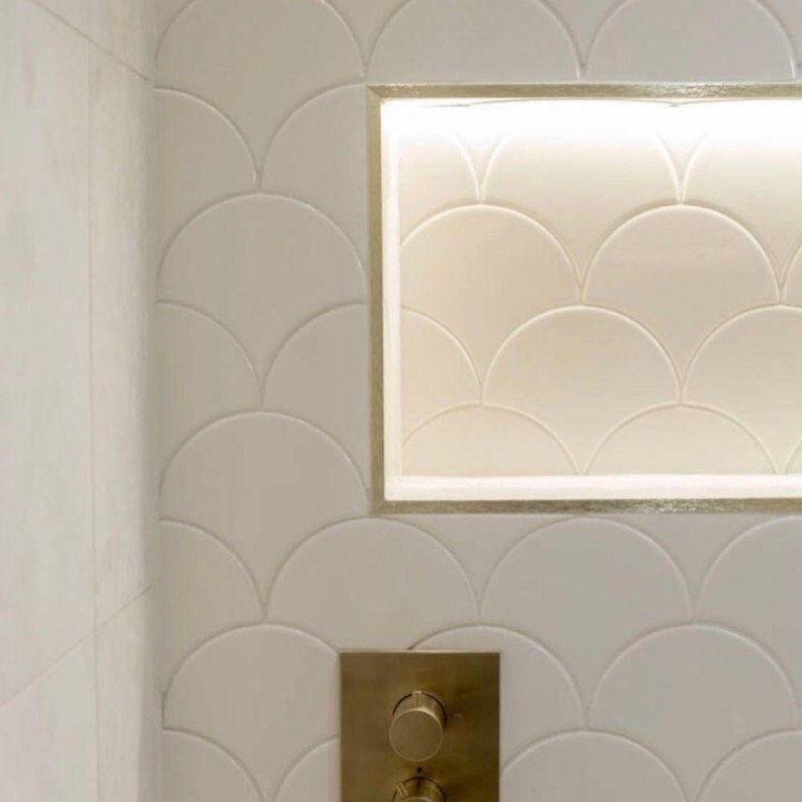 Soho So Linen white scallop wall tiles on a shower