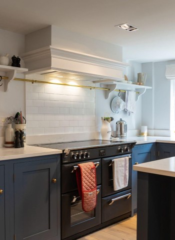 A Navy Kitchen by Weir and Webb featuring Underground Covent Garden metro wall tiles