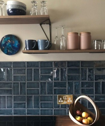 Basketweave patterned Savernake small brick wall tiles in a kitchen designed by Tytti Seppi