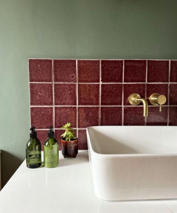 Halcyon Carmine handmade purple wall tiles in a bathroom splashback