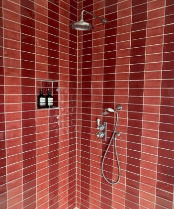 Seasons Evening Glow and Shepherds Delight in this striped shower space designed by Otta Design