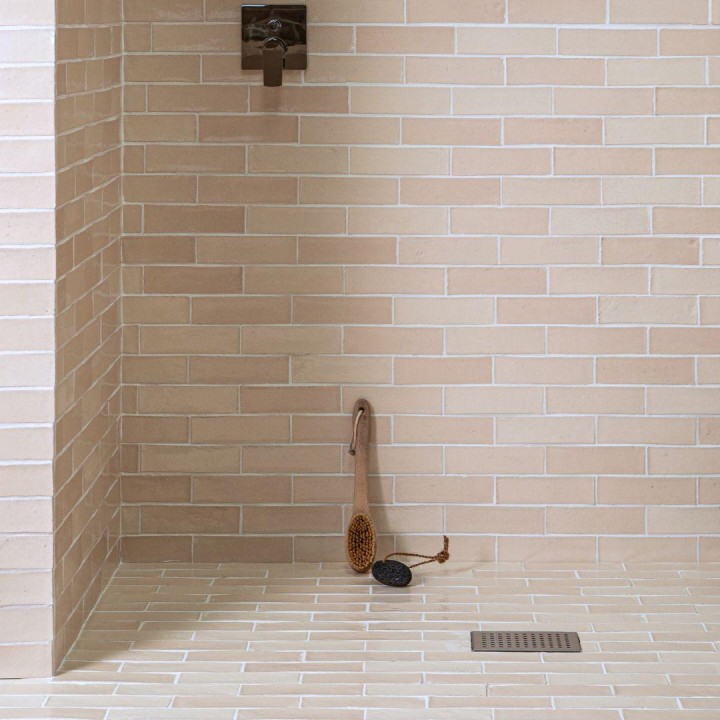 Isles Uist 7x21cm Skinny metro wall tiles on walk in shower floor and walls