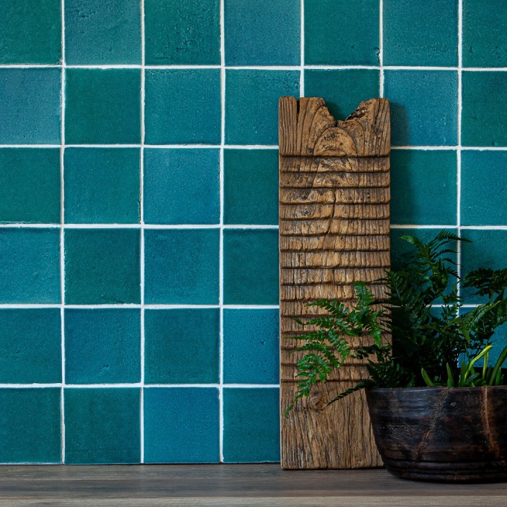 Isles Harris 11cm x 11cm Square Tiles on wall with vintage wooden washboard and houseplant in front