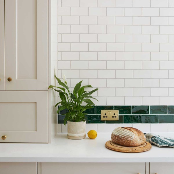 Kitchen sideboard with emerald green and white tiles