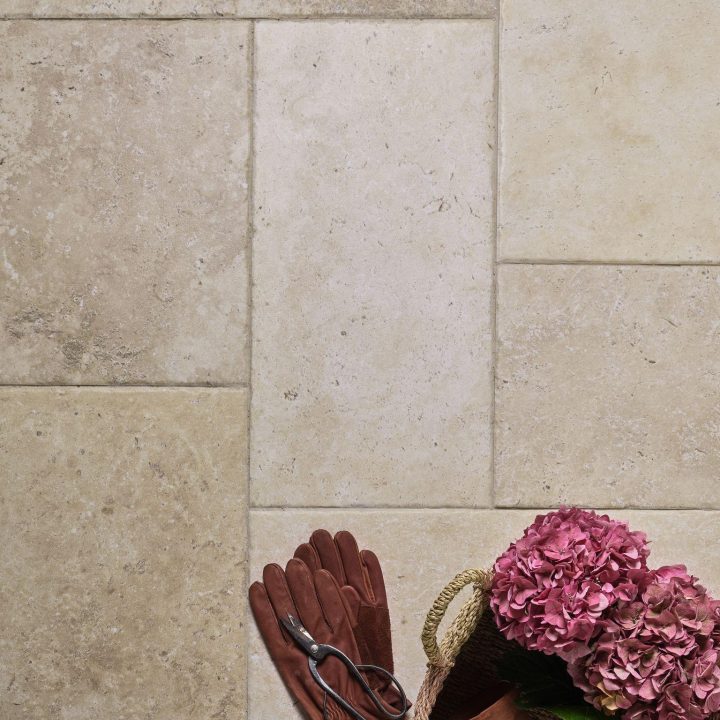 Our lovely French Limestone flagstone with tumbled edges have been used here in our four tile layout to create a traditional look. This classic look is completed with limestone grout.