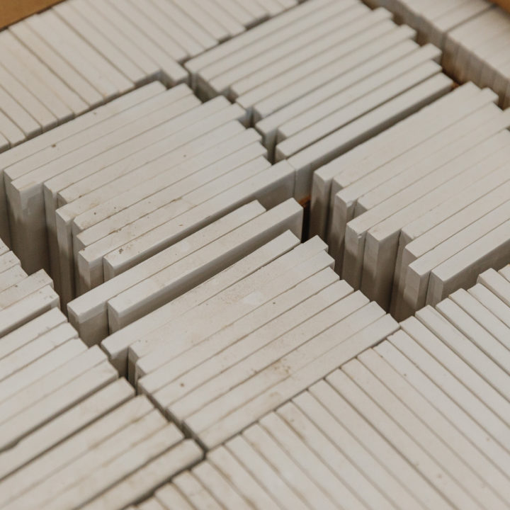 Stacks and stacks of white square tiles