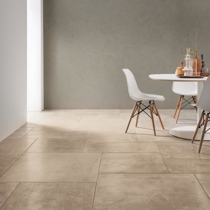 Commercial office space with stone effect floor tiles and white modern table and chairs