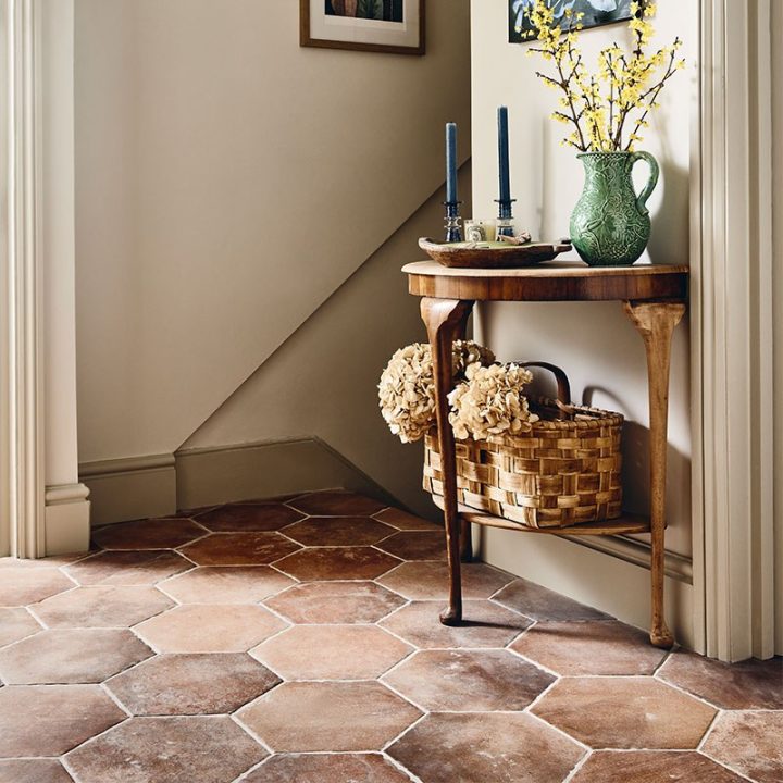 The hallway in Harriet Howarth's London home laid with Granada Hexagon tiles