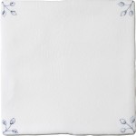 Cut out image of one white tile with blue delft illustrations of an ornate floral pattern corners