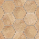 A flat lay of pale terracotta Seville Hexagon tiles laid in a classic grid pattern and finished with Medium Grey grout