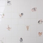 Wall of hand painted animal square tiles paired with plain tiles cockerels, highland cows, pigs and horses