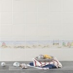 Wall of Hand painted bathroom beach square tile borders in a seaside style with sand and sea with beach huts and boats