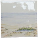 Hand painted bathroom beach square tile in a seaside style with sand and sea