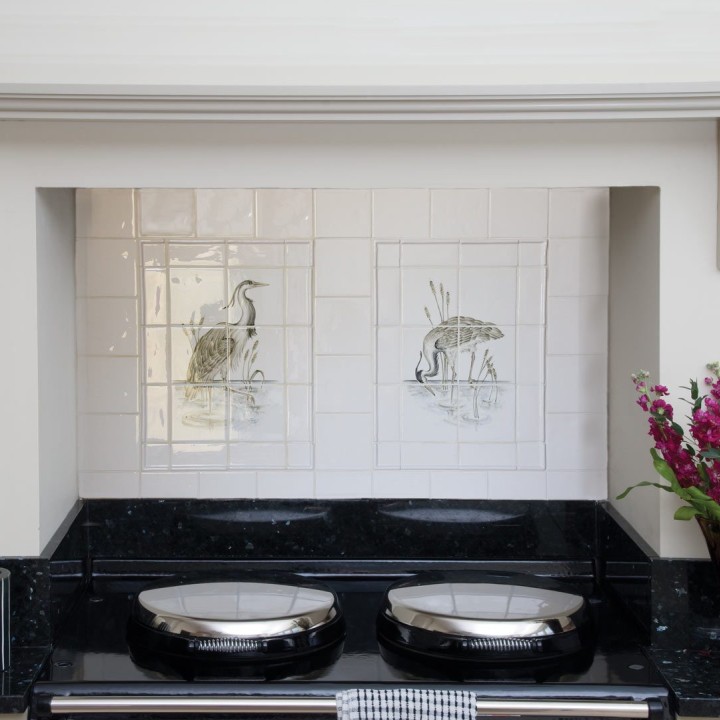 Wall of cooker splashback hand painted Lakeside Heron & branch cooker tile panel splashback