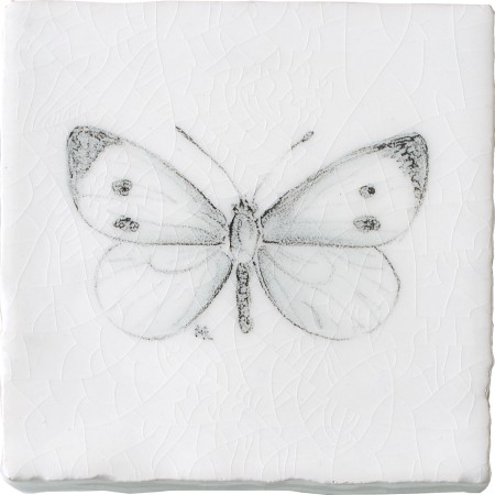 Cut out of a hand painted butterfly taco square tile in a charcoal etching style