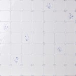 Wall of delft flower square tiles mixed with plain delft tiles in the classic blue style with white grout