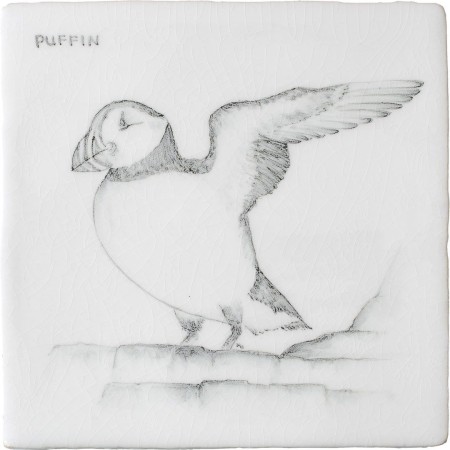 Cut out of a hand painted Puffin bird square tile in a classic charcoal style