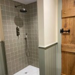 Aged Linen green square tiles in shower