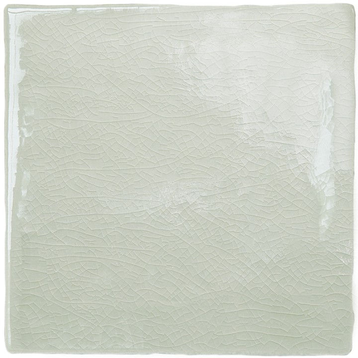 Cut out image of a pale green crackle glazed square tile