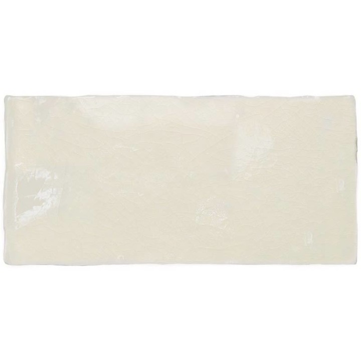Cut out image of a cream crackle glazed brick tile
