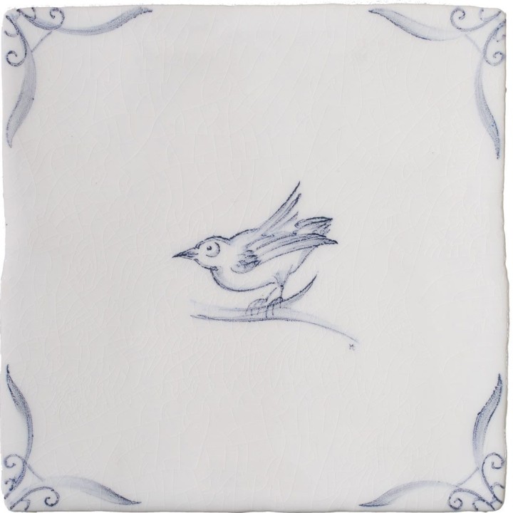 Cut out of a delft birds square tile with the classic blue style with an ivory background and ornate delft corners