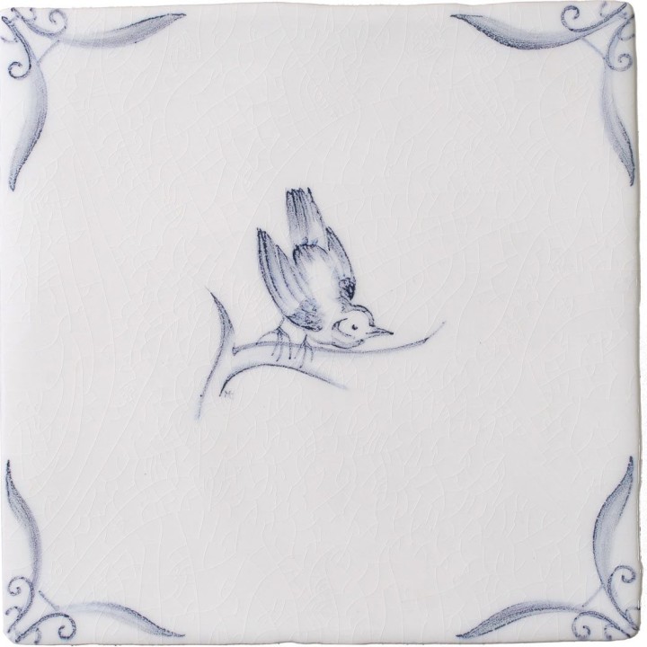 Cut out of a delft birds square tile with the classic blue style with an ivory background and ornate delft corners