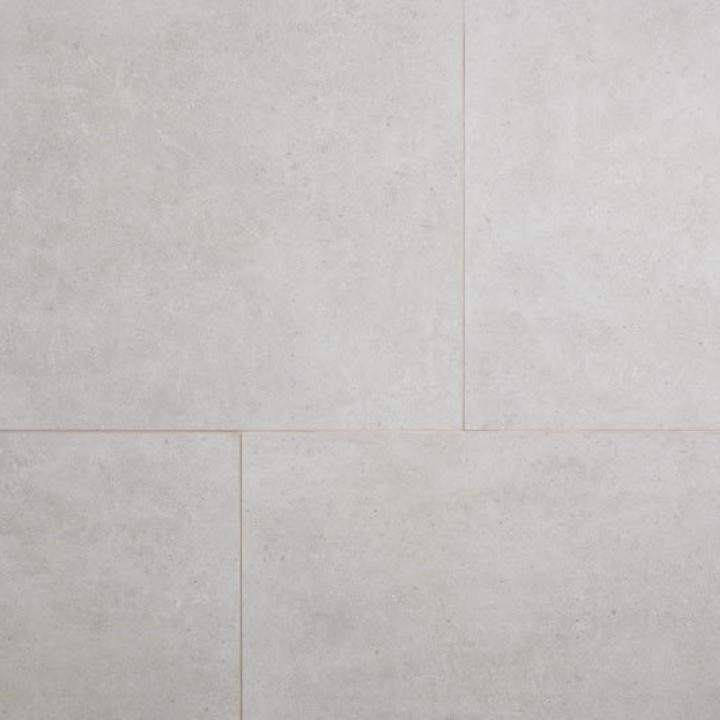 Close up of four Dorset stone effect porcelain floor tile flat lay with a vase of pink roses and a coffee on top with beige grout