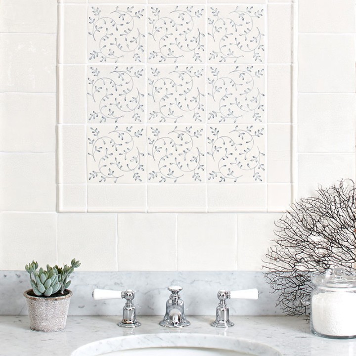 Flax Blue Pattern Square tiles wall panel, framed with half rounds and paired with Emma Flax Blue Plain Square tiles and border tiles behind a bathroom sink