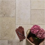 Combined layout of french limestone floor tiles in a formation of squares and rectangles with gardener's basket on top
