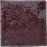 Cut out of artisan rustic handmade burgundy red square tile