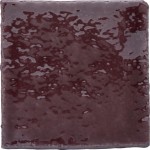 Cut out of artisan rustic handmade burgundy red square tile