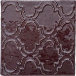 Cut out of artisan rustic burgundy red square tile with ornate pattern piped on top