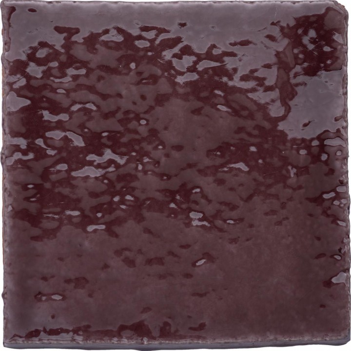 Cut out of artisan rustic handmade burgundy red square tile