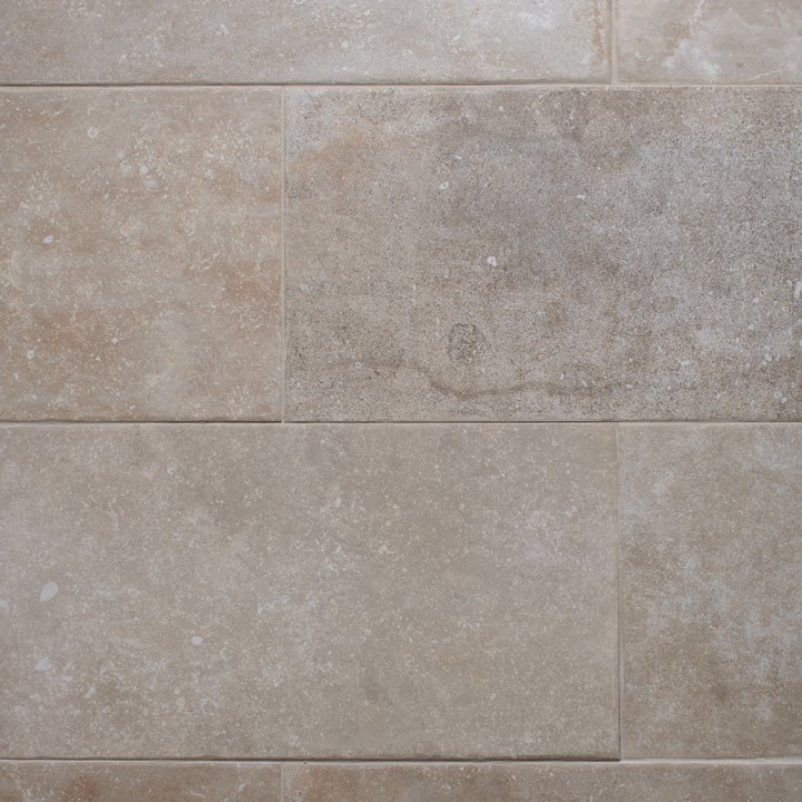 Floor of warm stone effect porcelain floor tile with Beige grout