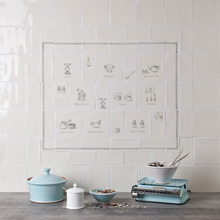 Wall of tiles with kitchenware and utensil charcoal illustrations for a range cooker tile panel styled with cottage kitchen decor