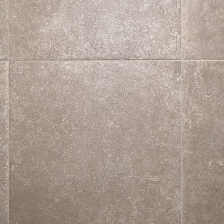 Warm brown stone effect square porcelain floor tile with beige grout