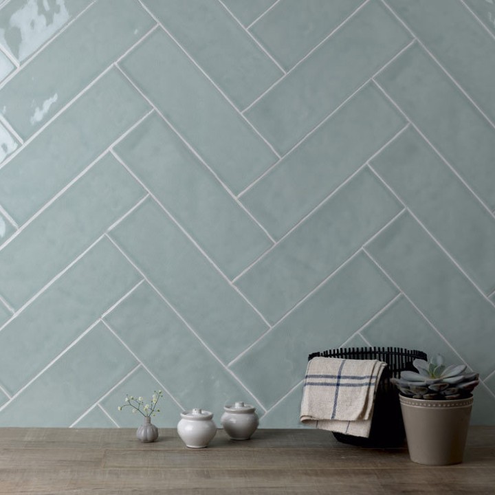Cut out of a pale green gloss long metro brick tile