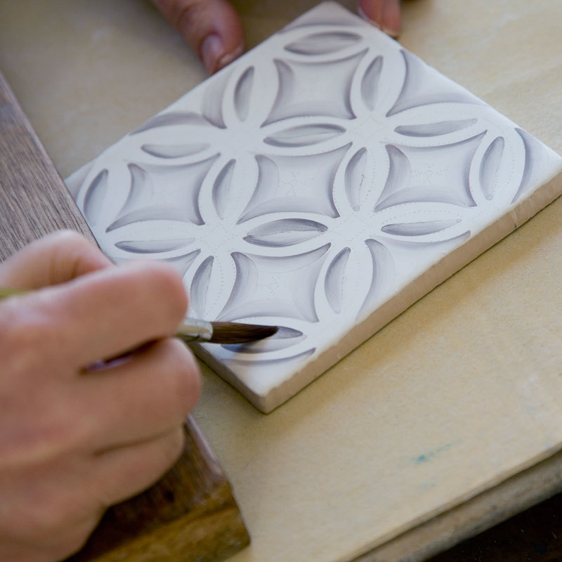 Each stroke painted directly into raw glaze