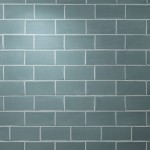 Wall of teal blue green matt metro tile laid in a brick bond tile pattern