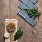 Flatlay featuring wood effect floor tiles and a sky blue matt skinny metro tile