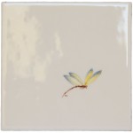 Cut out of a yellow and blue winged dragonfly ivory tile