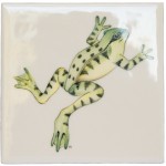 Cut out of a green leaping frog ivory tile