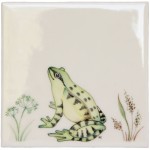 Cut out of a green sitting frog ivory tile
