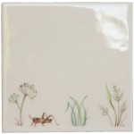 Cut out of a cricket sat amongst the pond grasses on an ivory tile
