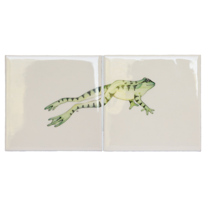 Cut out of two tile panel with a green leaping frog ivory tile