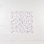 Wall of ivory square tiles framing a 9 pink pattern tiles
