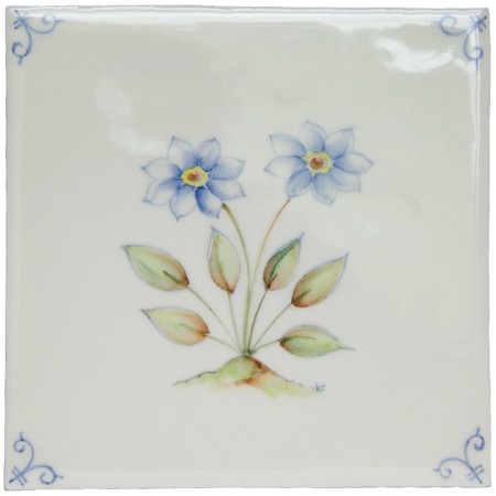 Cut out of an ivory square tile with hand painted delft corners and forget-me-not blue flower
